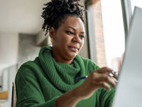 Adult woman working from home office