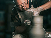 Senior man working on pottery