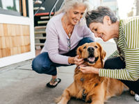 Two woman with a dog