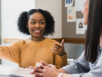 Two woman collaborating together